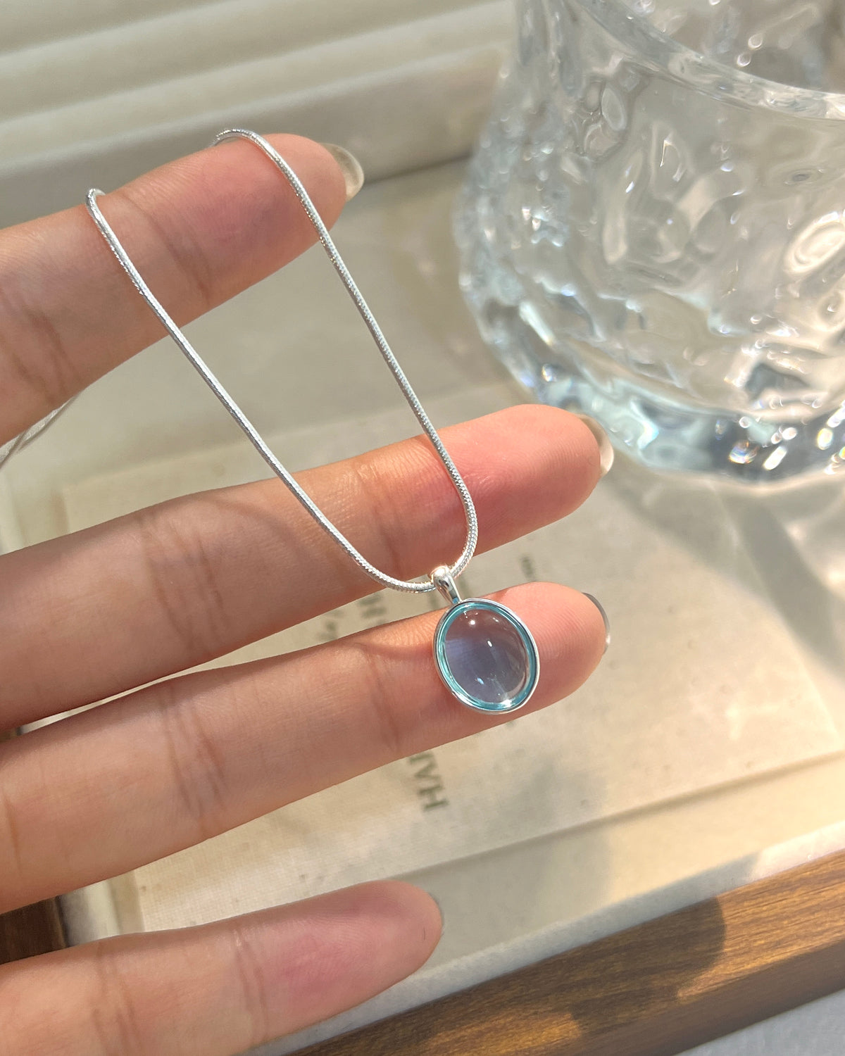 Minimalist necklace styled with layered chains