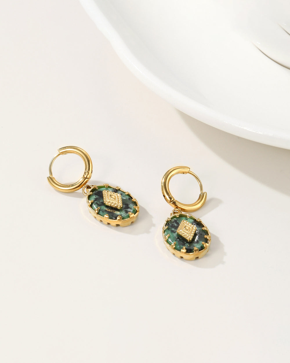 Turquoise stone earrings paired with layered necklaces for modern style