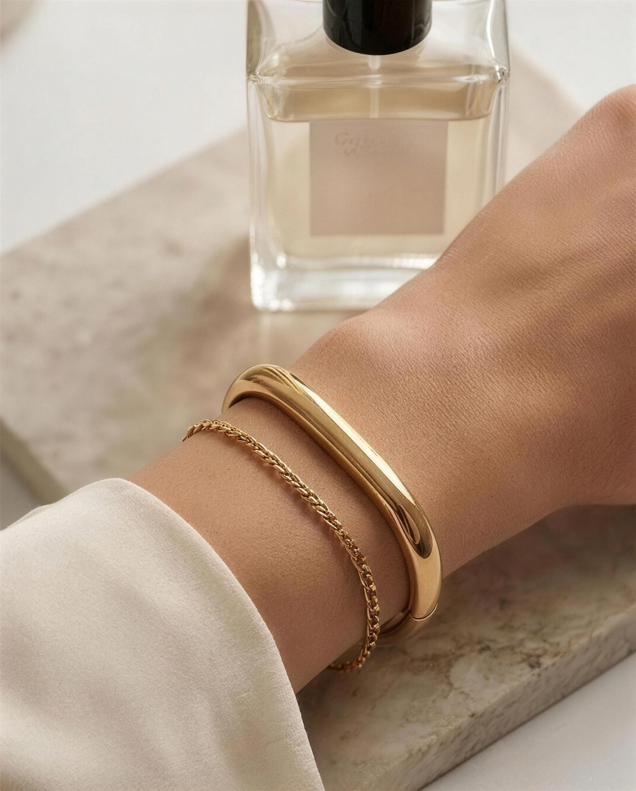 model wearing minimalist gold bangle everyday style