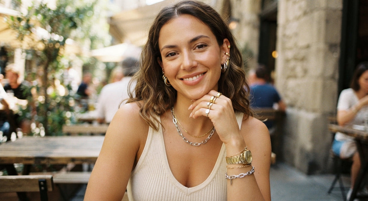 Woman wearing mixed gold and silver jewelry