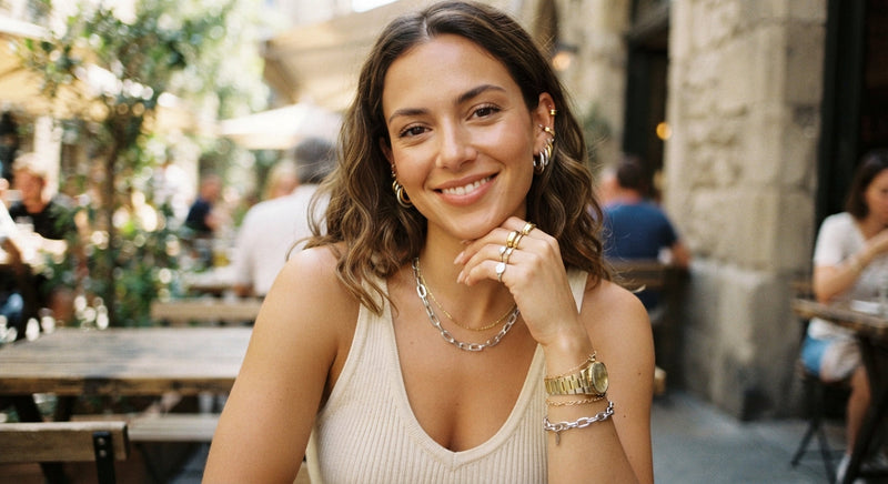 Woman wearing mixed gold and silver jewelry