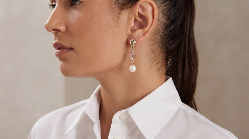 Woman wearing jewelry with a white shirt