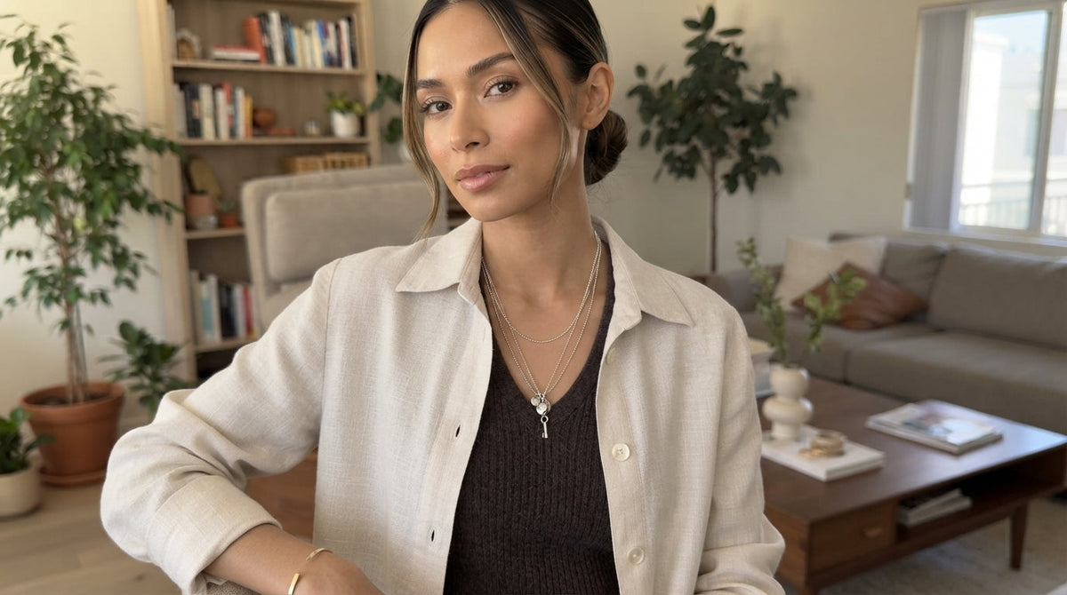 Woman wearing a pendant necklace with a V-neck top