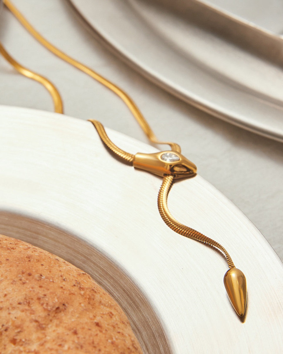 Tarnish-free smooth gold snake chain texture closeup