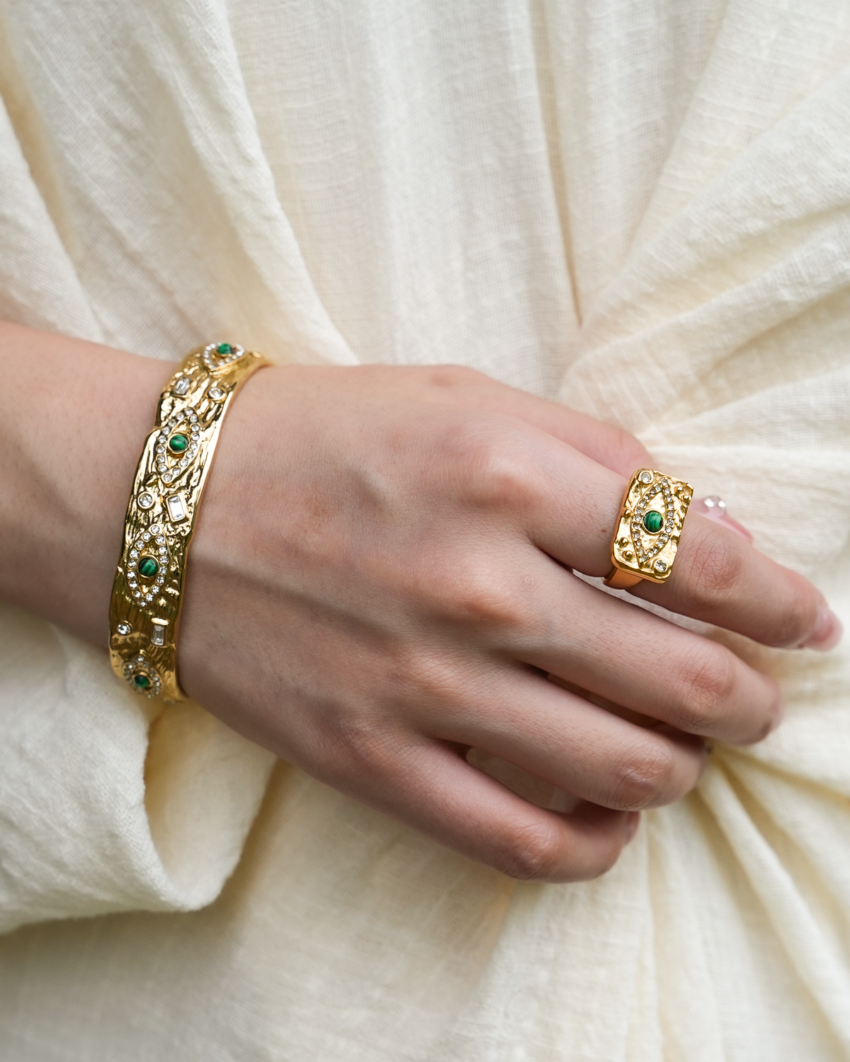 Model wearing Yuhe Evil Eye Bangle, a jewelry piece perfect to wear everyday